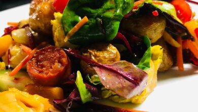 Warm salad Chorizo haloumi roasted vegetables and leaves dressed in